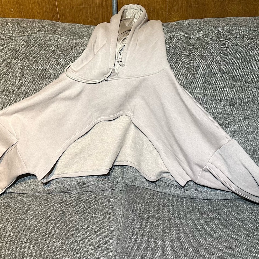Popflex shruggie or hooded shrug it’s a tan/beige color size L/XL. Never worn